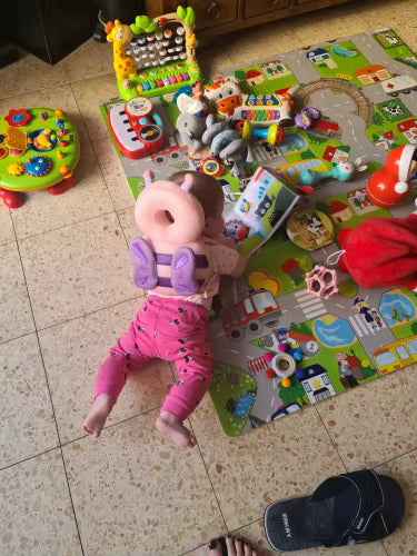 Baby sitting with protective pillow