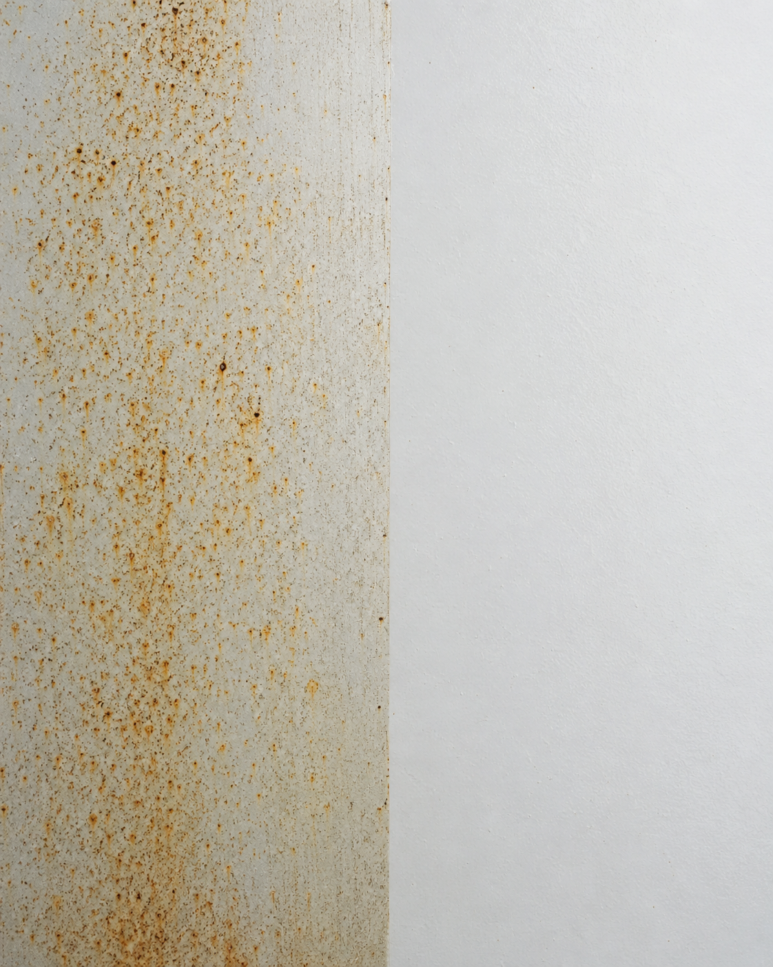 Before and after orange rust spot cleaning on metal