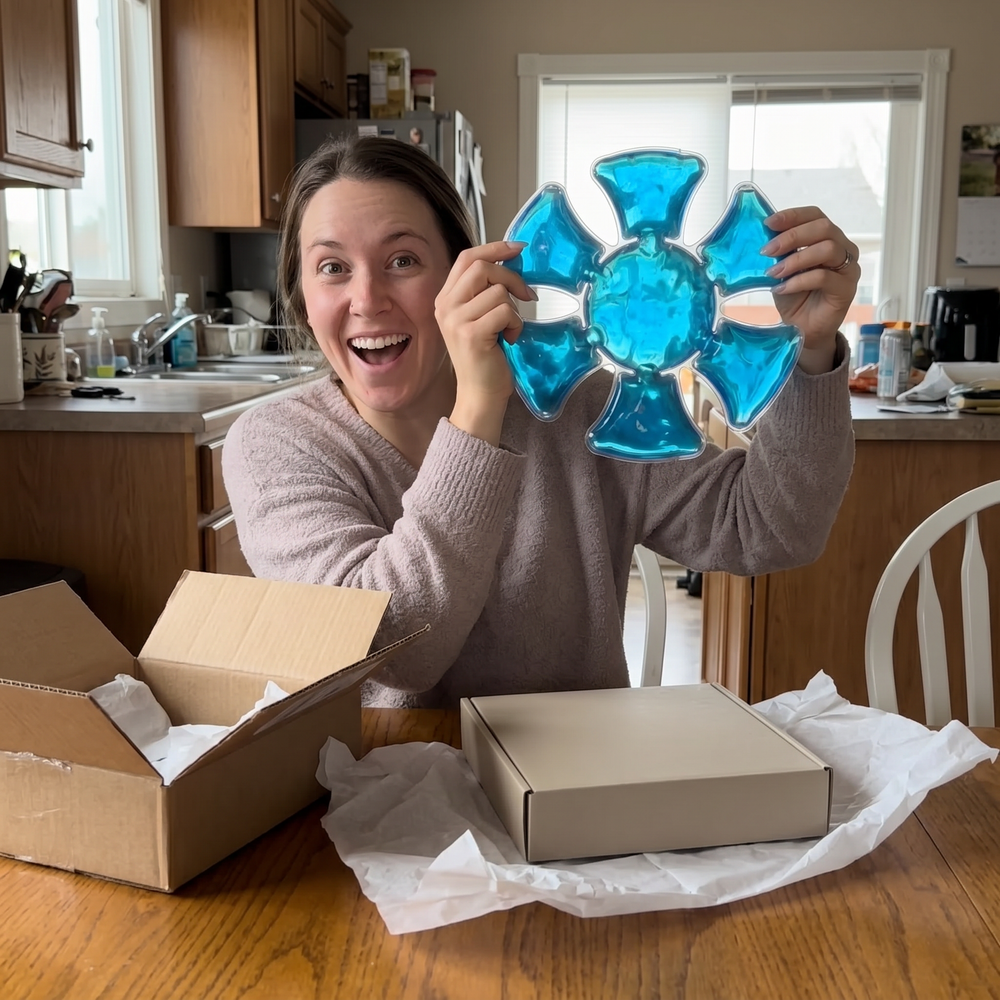 Customer holding The Cap Buddy at home